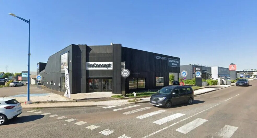 Retail in Quetigny for lease - Building Photo - Image 1 of 3