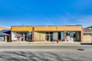 Brick Building with Five Storefronts - Parking Garage