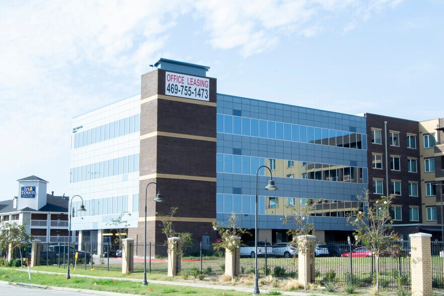 1220 W Trinity Mills Rd, Carrollton, TX for lease - Building Photo - Image 1 of 25