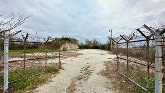 Fenced & Rocked Storage Lot (29,500 SF) - Warehouse